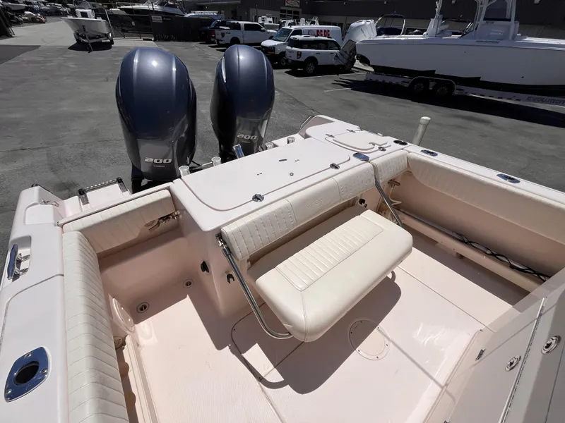 Slide: The Image of 2013 Grady-White Fisherman 257 boat with dual engines and seating area. - 6