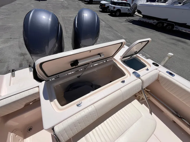 Slide: The Image of 2013 Grady-White Fisherman 257 boat with open storage compartments and dual engines. - 8