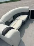 Slide: The Image of 2024 Sylvan Mirage 8522 LZ boat seating with elegant, curved design and premium upholstery. - 2