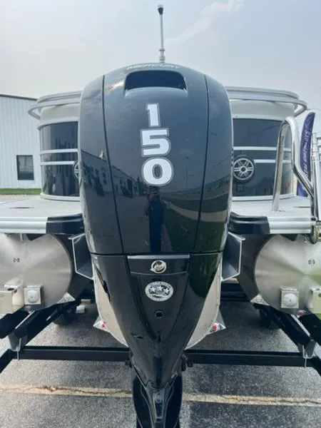 Slide: The Image of 2024 Sylvan Mirage 8522 LZ with 150 HP outboard motor, rear view. - 5