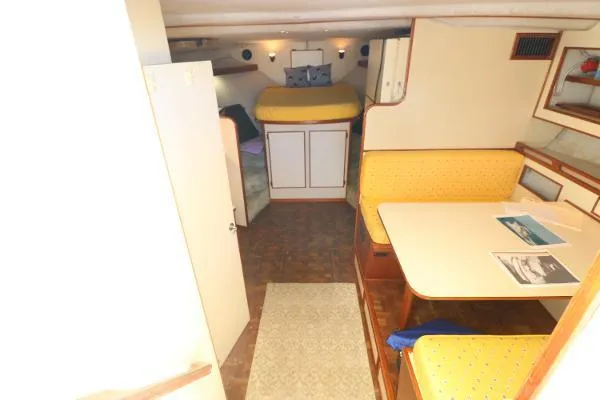 Slide: The Image of Interior of 1991 Atlantic 38 Super Sport yacht with cozy dining and sleeping areas. - 15