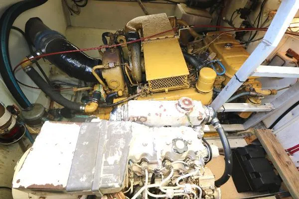 Slide: The Image of Engine room of a 1991 Atlantic 38 Super Sport boat, showcasing mechanical components. - 25