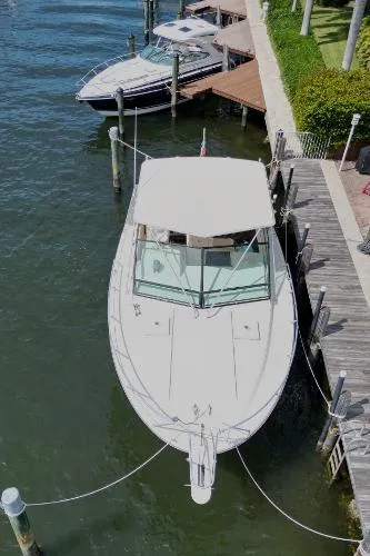 Slide: The Image of 1991 Atlantic 38 Super Sport docked at a marina, aerial view. - 28