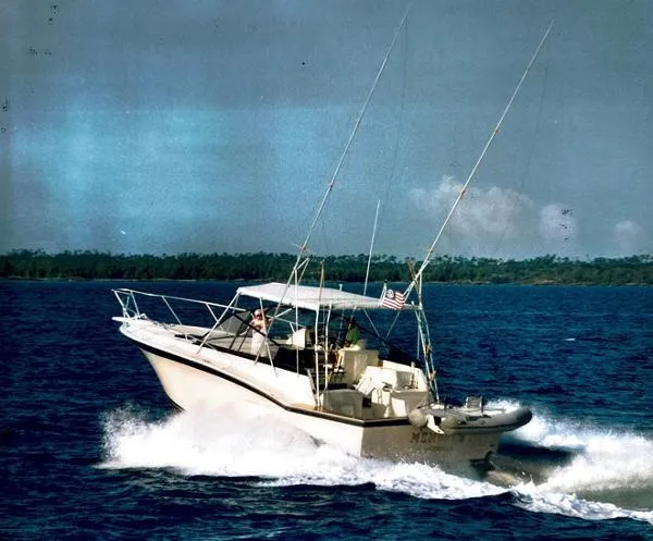 Slide: The Image of 1991 Atlantic 38 Super Sport boat cruising on open water. - 30