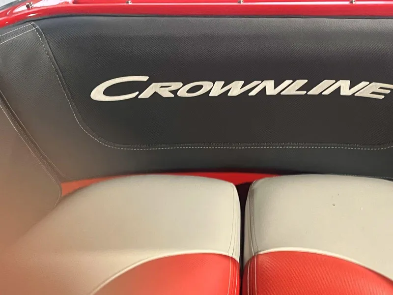 Slide: The Image of 2022 Crownline 240 SS LPX boat interior with branded seating in red and gray. - 10