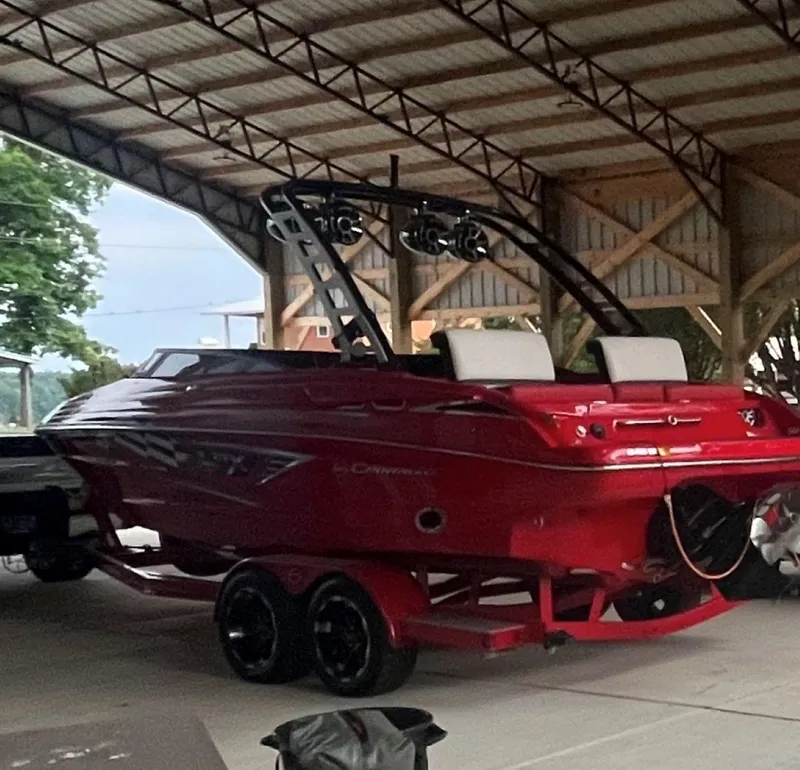 Slide: The Image of 2022 Crownline 240 SS LPX boat in a covered storage area. - 4