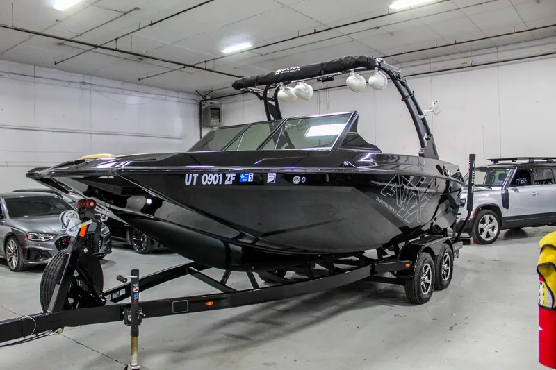 Slide: The Image of 2021 ATX Surf Boats 22 Type-S on trailer in indoor storage facility. - 1