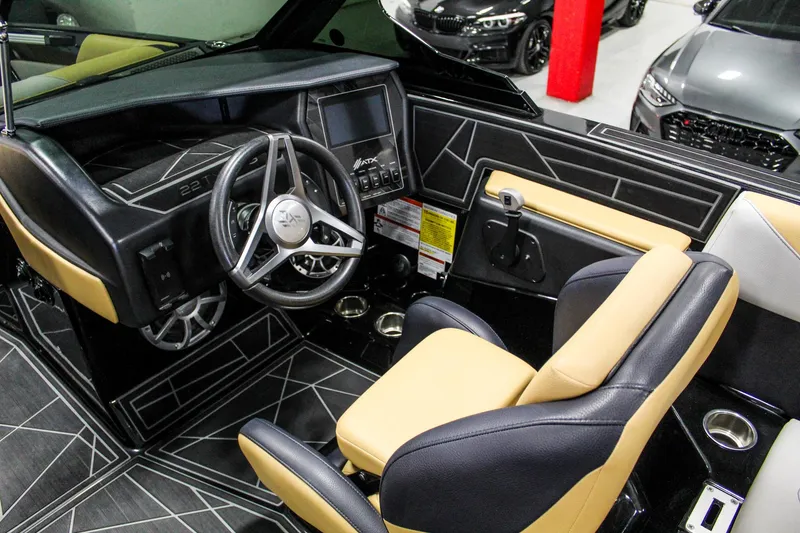 Slide: The Image of 2021 ATX Surf Boats 22 Type-S interior with modern dashboard and steering wheel design. - 11