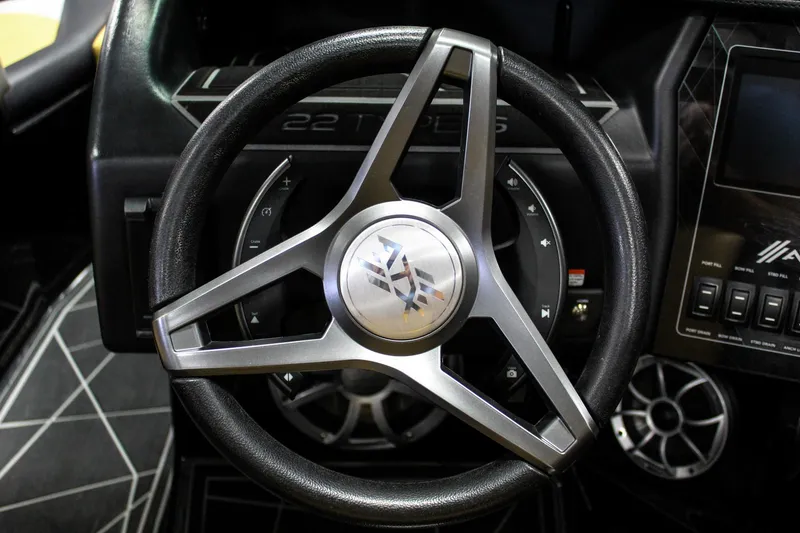 Slide: The Image of Steering wheel of 2021 ATX Surf Boats 22 Type-S with modern dashboard design. - 12