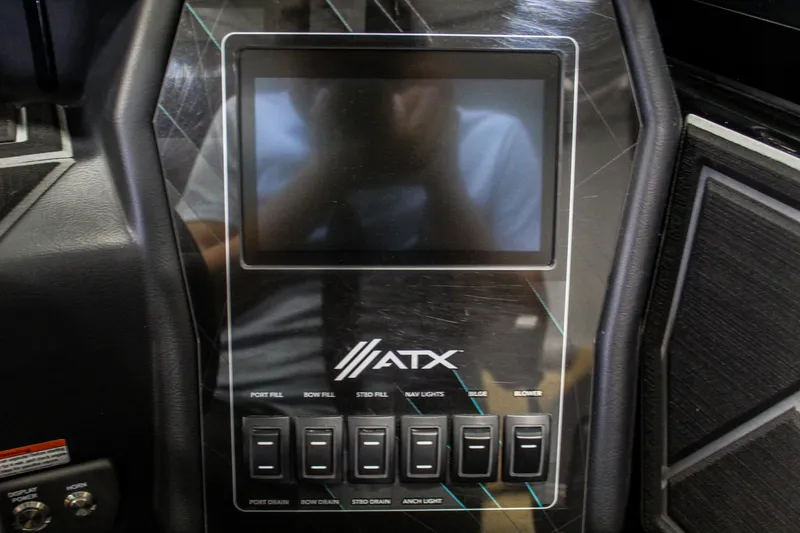 Slide: The Image of ATX Surf Boats 22 Type-S 2021 dashboard with touchscreen and control switches. - 13