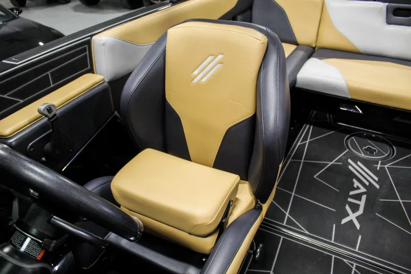 Slide: The Image of 2021 ATX Surf Boats 22 Type-S interior with tan and black seating. - 16