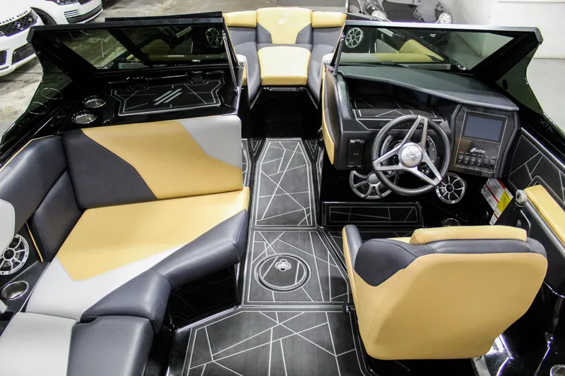 Slide: The Image of 2021 ATX Surf Boats 22 Type-S interior with modern seating and sleek dashboard design. - 23