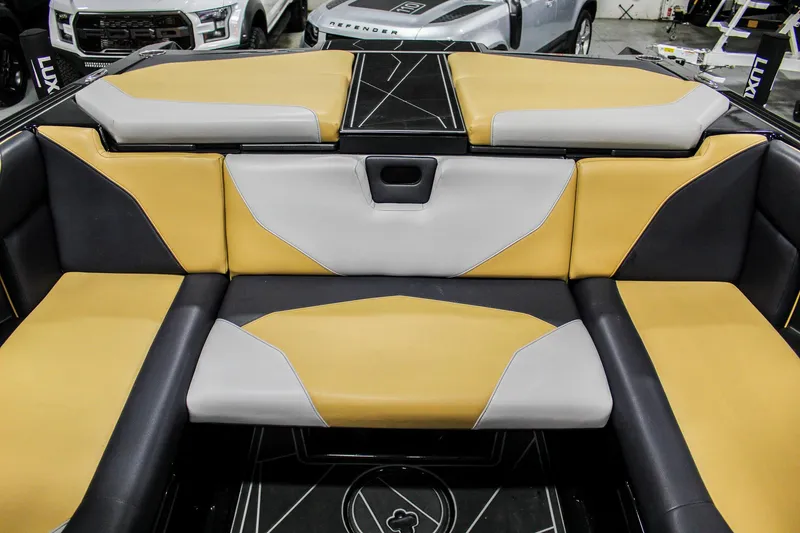 Slide: The Image of 2021 ATX Surf Boats 22 Type-S interior with yellow and gray seating. - 27