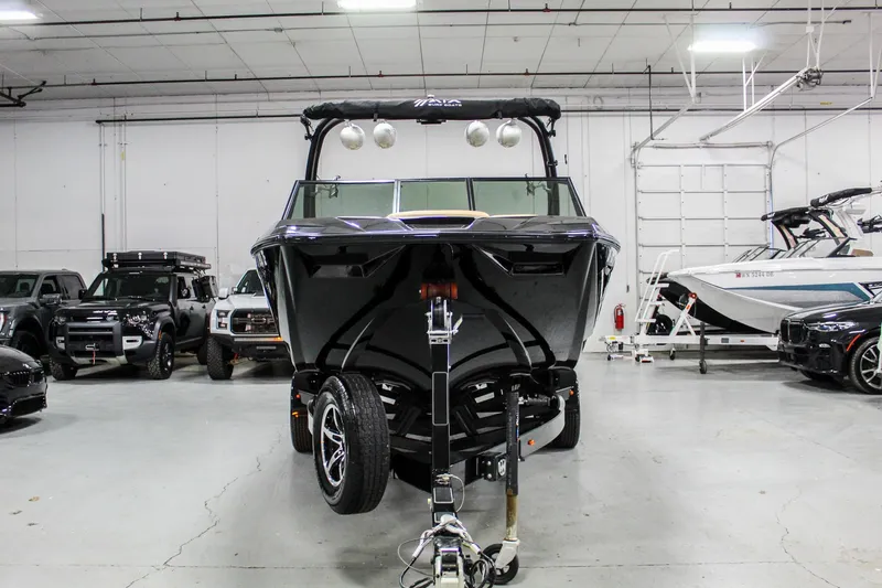 Slide: The Image of 2021 ATX Surf Boats 22 Type-S in a showroom, surrounded by vehicles. - 3