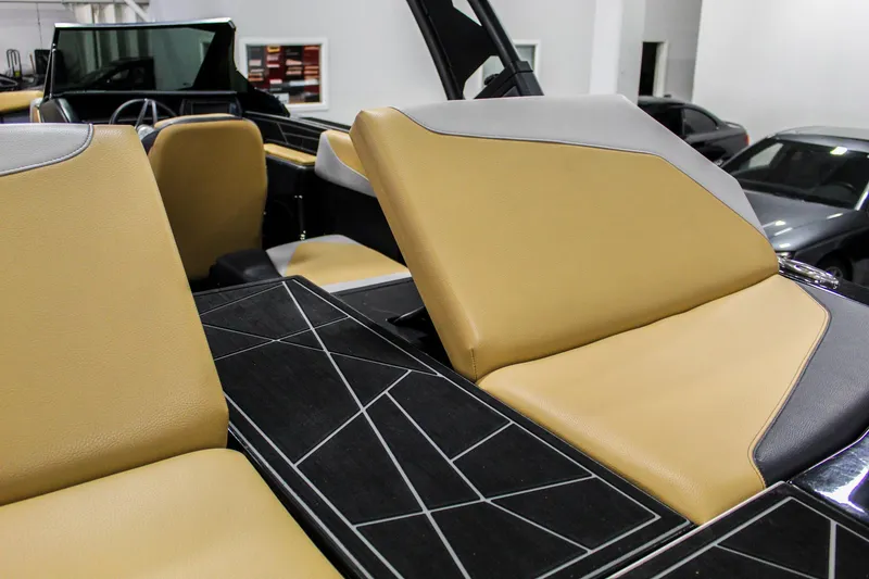 Slide: The Image of 2021 ATX Surf Boats 22 Type-S interior with tan and black seating. - 32