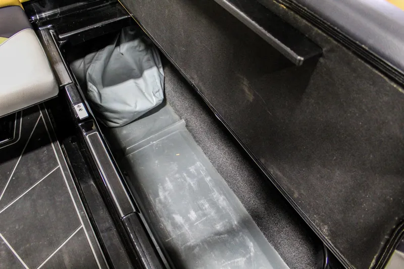 Slide: The Image of 2021 ATX Surf Boats 22 Type-S storage compartment, open and empty. - 36