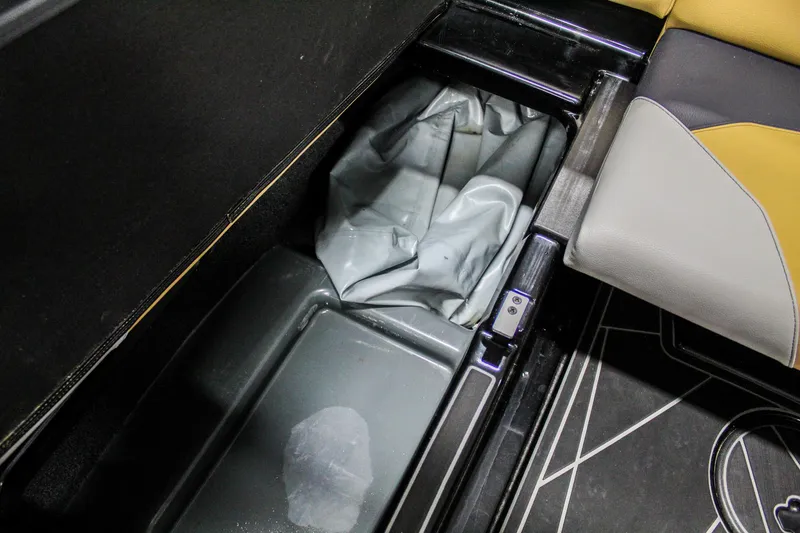 Slide: The Image of 2021 ATX Surf Boats 22 Type-S interior storage compartment with seat and flooring detail. - 37