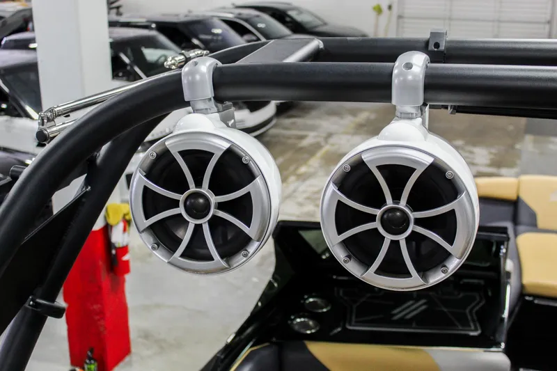 Slide: The Image of 2021 ATX Surf Boats 22 Type-S with mounted speakers in a showroom. - 39