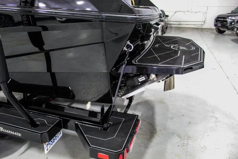 Slide: The Image of 2021 ATX Surf Boats 22 Type-S rear view in a garage setting. - 43