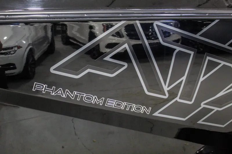 Slide: The Image of 2021 ATX Surf Boats 22 Type-S Phantom Edition logo on sleek black surface. - 45