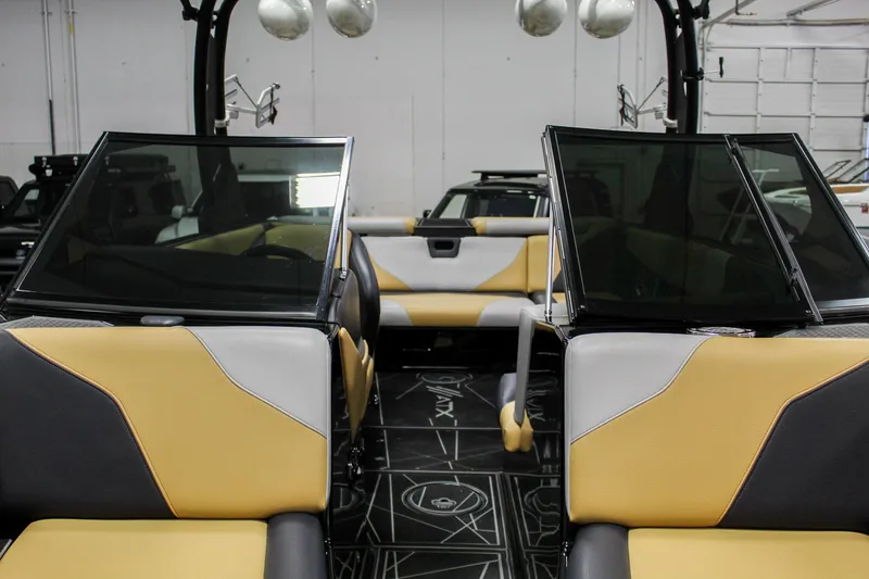 Slide: The Image of 2021 ATX Surf Boats 22 Type-S interior with yellow and gray seating, open windshield. - 47