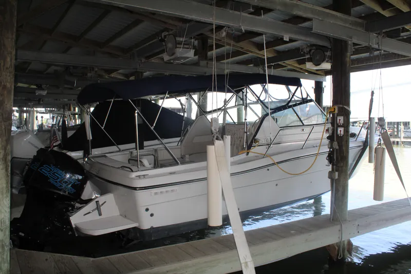 Slide: The Image of 1992 Stamas 288 Liberty boat docked in a covered marina. - 25