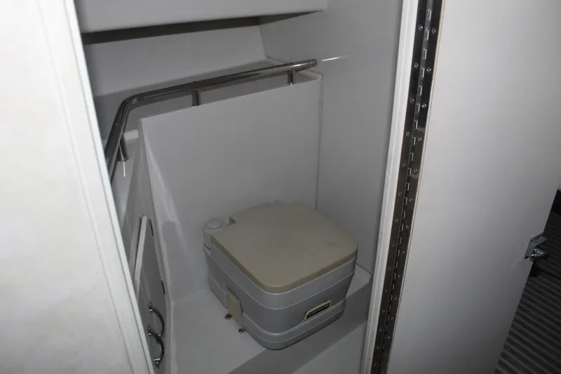 Slide: The Image of 1992 Stamas 288 Liberty boat interior with compact marine toilet. - 17