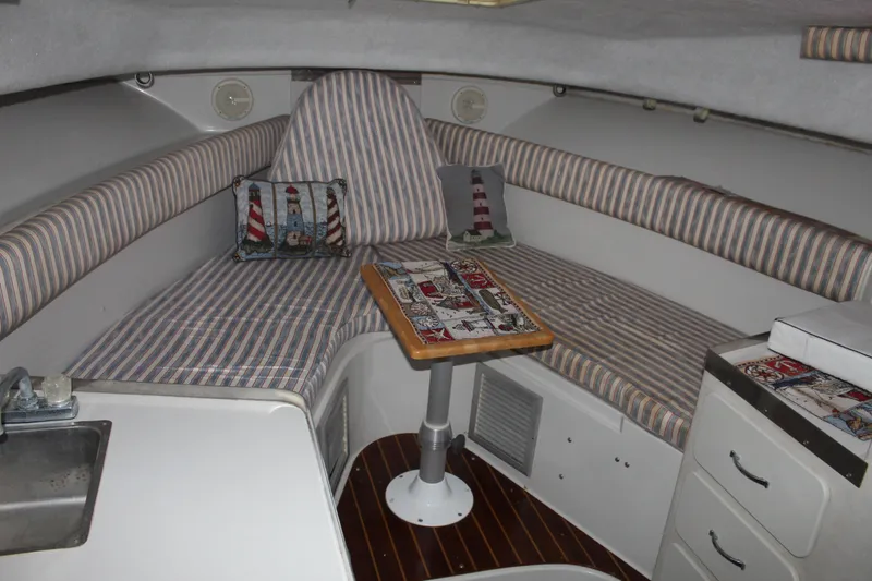 Slide: The Image of Interior of 1992 Stamas 288 Liberty boat with striped seating and nautical decor. - 13