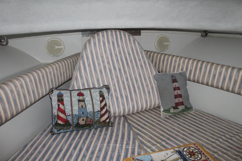 Slide: The Image of Interior of 1992 Stamas 288 Liberty boat with striped cushions and lighthouse-themed pillows. - 21