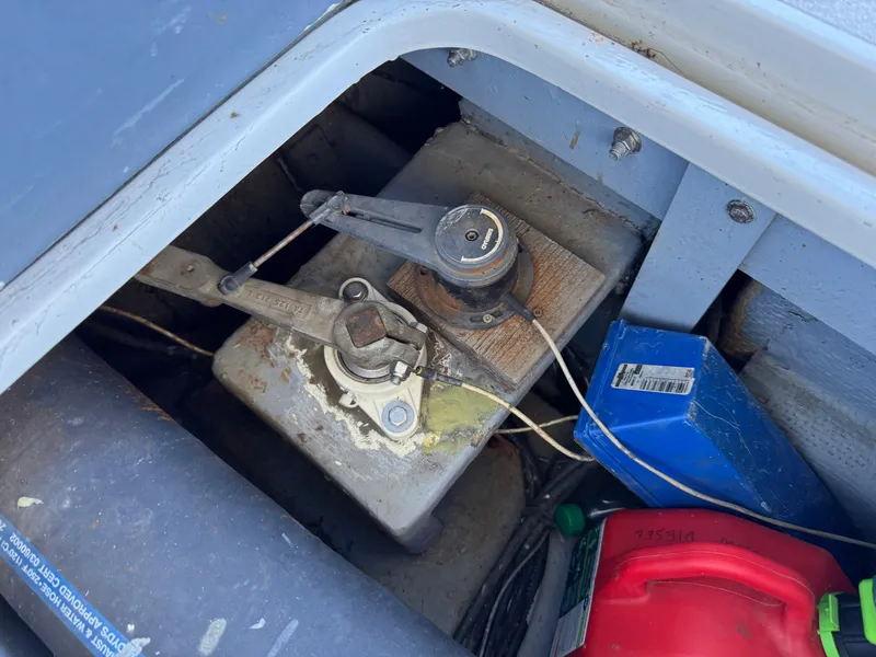 Slide: The Image of 1978 Bertram 31 Sportfisher Yanmars engine compartment with fuel tank and components. - 13