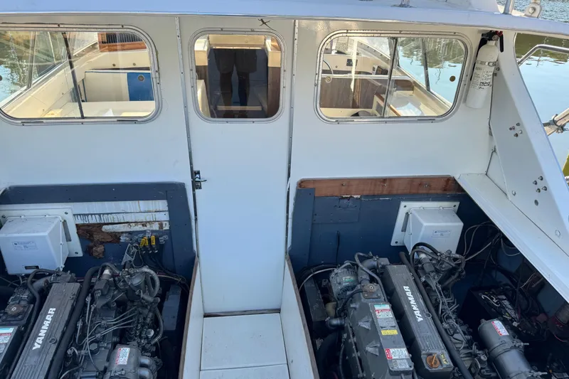 Slide: The Image of 1978 Bertram 31 Sportfisher Yanmars engine compartment with dual Yanmar engines. - 26