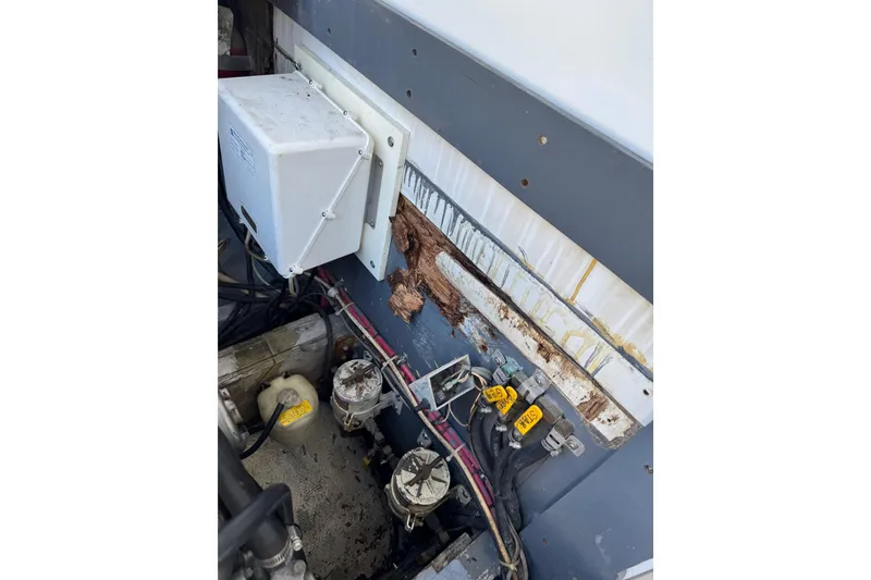 Slide: The Image of Engine compartment of a 1978 Bertram 31 Sportfisher Yanmars, showing wiring and components. - 29