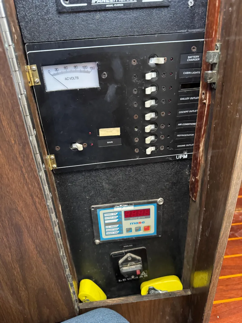 Slide: The Image of Electrical panel of a 1978 Bertram 31 Sportfisher Yanmars boat with switches and meters. - 6