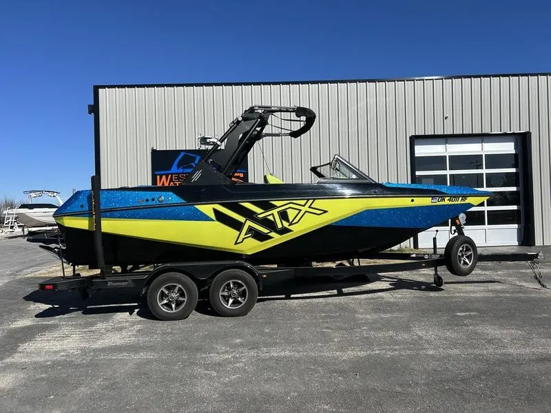 Slide: The Image of 2022 ATX Surf Boats 22 Type-S in blue and yellow on trailer. - 5