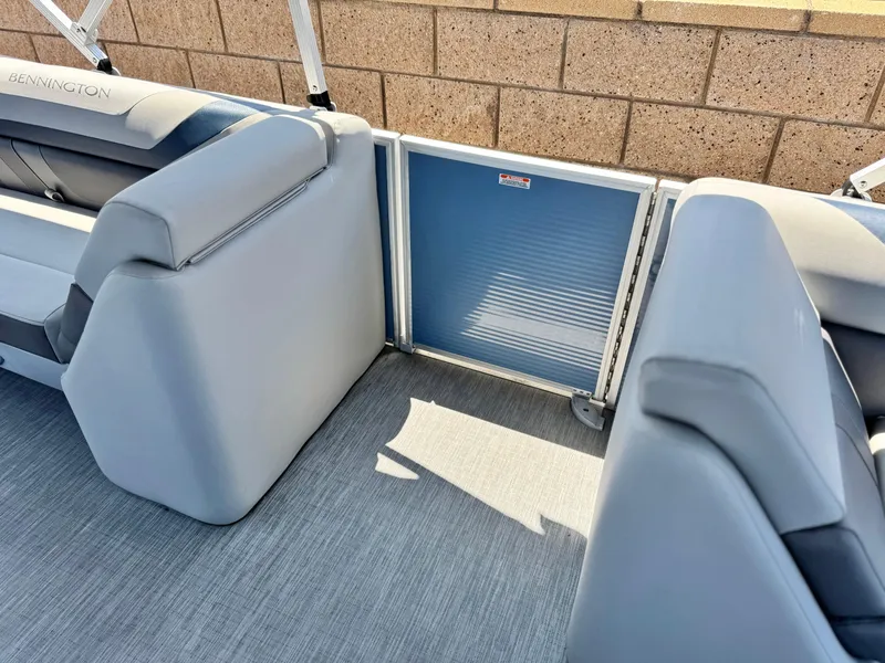 Slide: The Image of 2023 Bennington SX 21 boat interior with gray seating and flooring. - 14