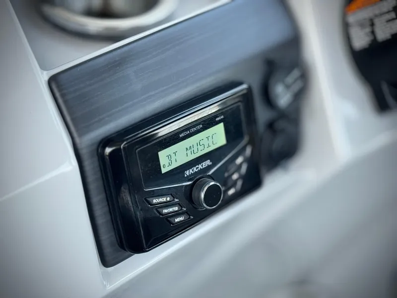 Slide: The Image of Kicker audio system in 2023 Bennington SX 21 boat dashboard. - 24