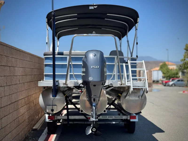 Slide: The Image of 2023 Bennington SX 21 pontoon boat with Yamaha 150 engine on trailer. - 4
