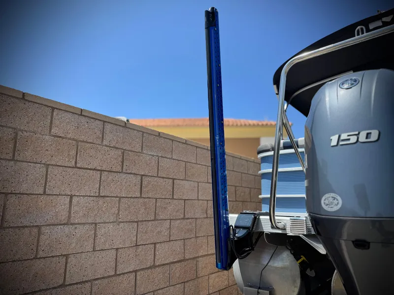 Slide: The Image of 2023 Bennington SX 21 boat engine with 150 horsepower, against a brick wall background. - 7