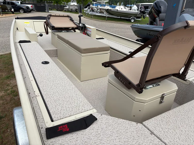 Slide: The Image of 2025 SeaArk 1652 Crappie boat interior with seating and storage compartments. - 9