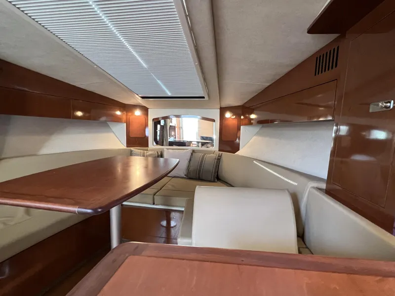 Slide: The Image of Luxurious interior of 2012 Sea Ray 310 Sundancer yacht with cozy seating and modern amenities. - 19