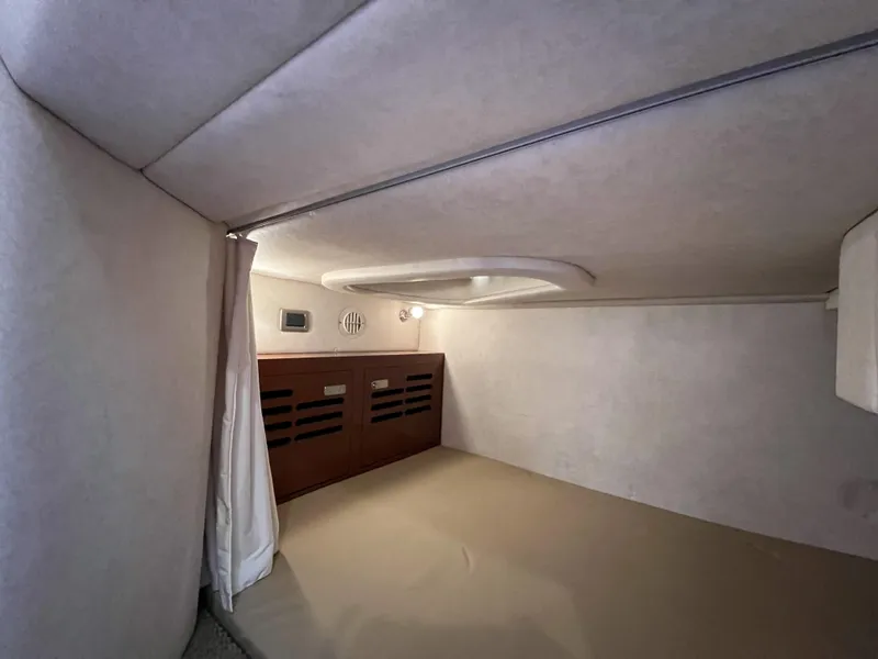 Slide: The Image of Interior of 2012 Sea Ray 310 Sundancer yacht with kitchenette, microwave, and sink. - 23