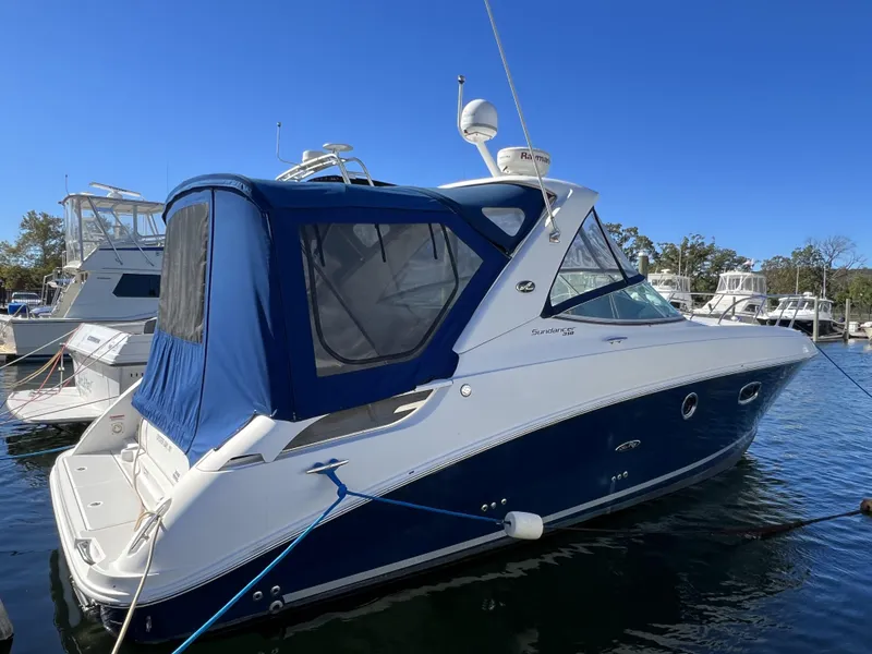 Slide: The Image of 2012 Sea Ray 310 Sundancer docked with blue cover, Oyster Bay, NY. - 3