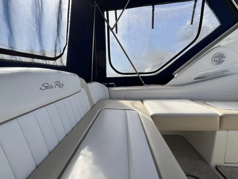Slide: The Image of Interior of 2012 Sea Ray 310 Sundancer boat with seating and kitchenette. - 6