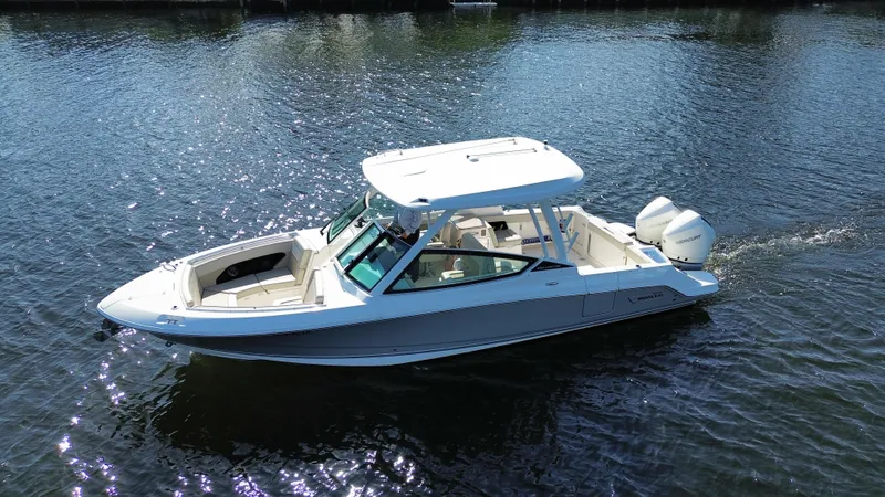 The Image of 2023 Boston Whaler 280 Vantage boat cruising on calm water. - 1