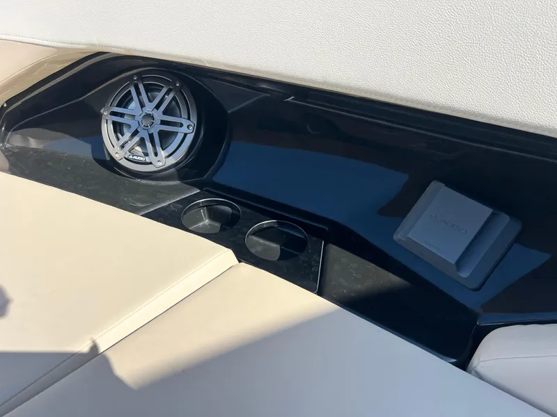 Slide: The Image of 2023 Boston Whaler 280 Vantage interior with speaker and cup holders. - 25