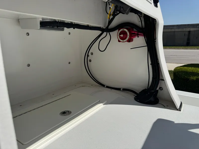 Slide: The Image of 2019 Shallow Sport 21 Sport boat interior wiring and storage compartment. - 11