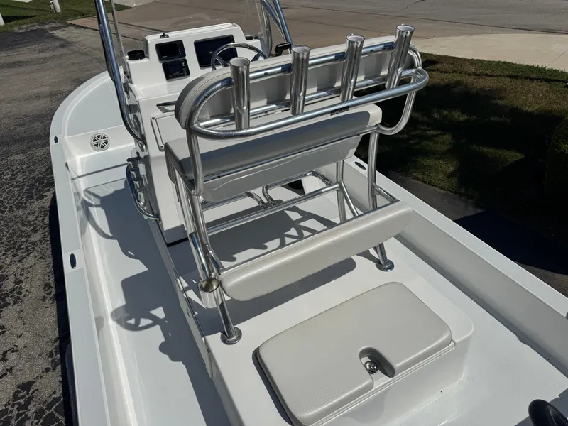 Slide: The Image of 2019 Shallow Sport 21 Sport boat interior with seating and rod holders. - 17