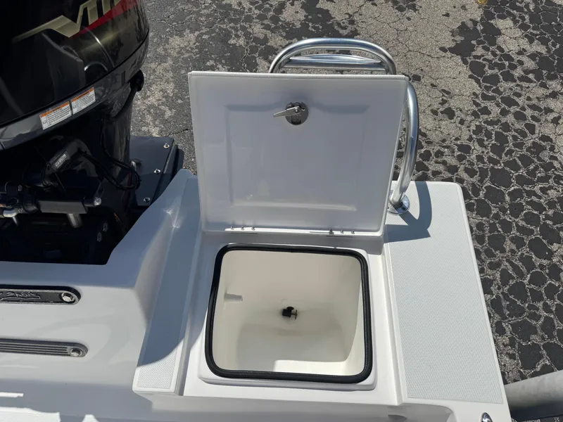 Slide: The Image of 2019 Shallow Sport 21 Sport boat with open storage compartment near the engine. - 27
