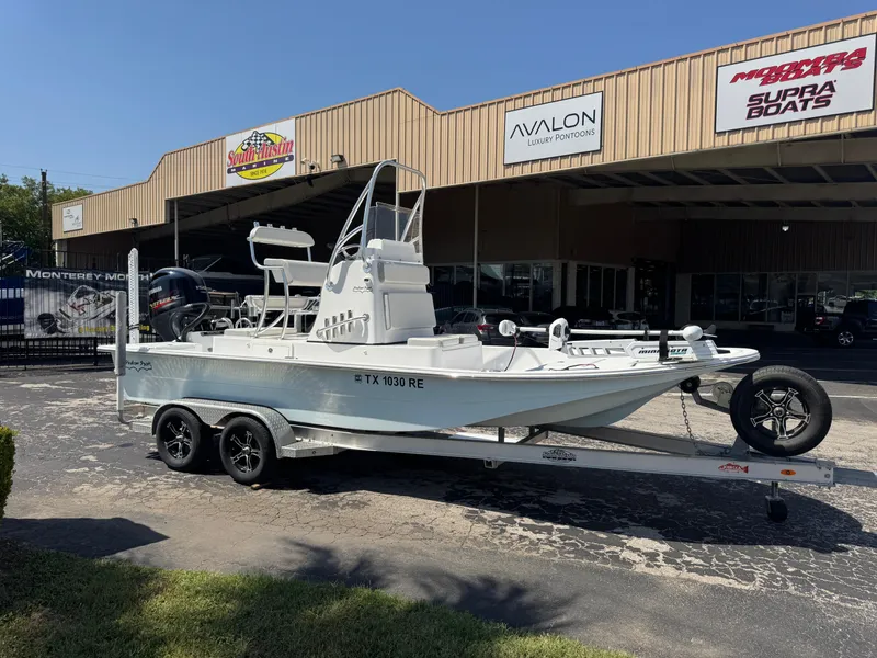 Slide: The Image of 2019 Shallow Sport 21 Sport boat on trailer outside dealership. - 30