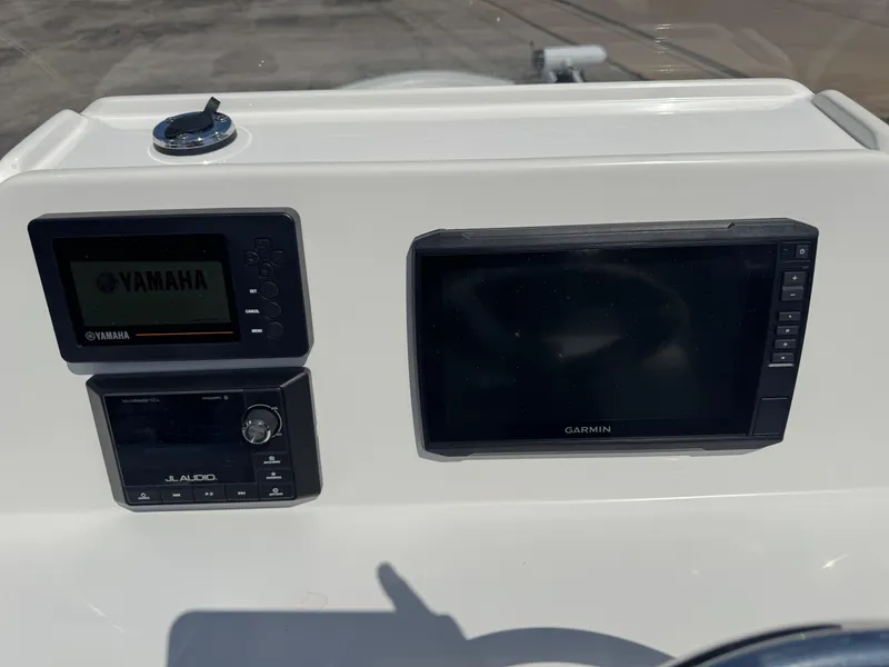 Slide: The Image of Control panel of a 2019 Shallow Sport 21 Sport boat with Yamaha and Garmin displays. - 6